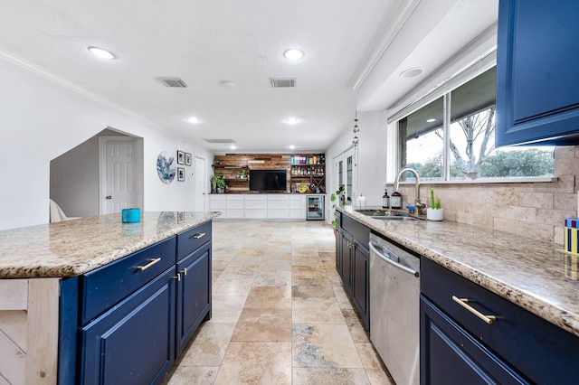 kitchen featuring blue cabinetry, crown molding, sink, and stainless steel dishwasher