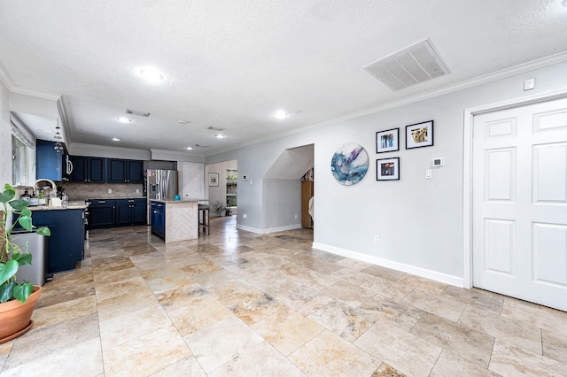 kitchen featuring stainless steel refrigerator with ice dispenser, ornamental molding, a breakfast bar, blue cabinetry, and a kitchen island