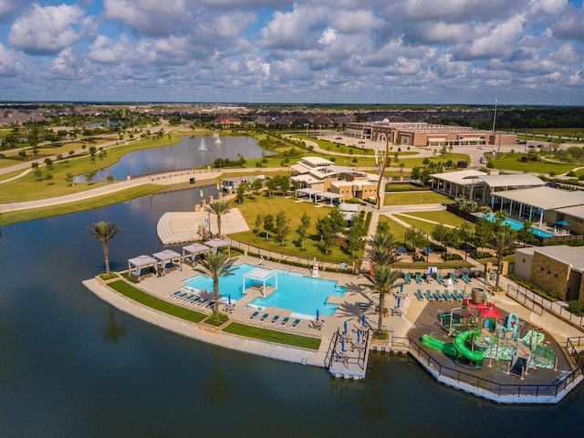 birds eye view of property with a water view