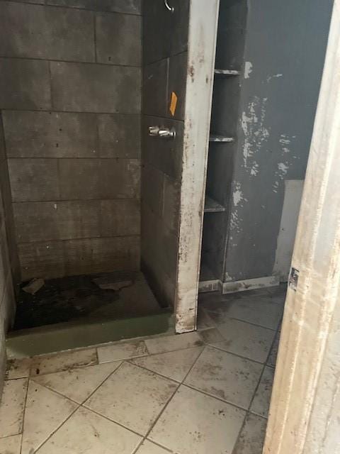 bathroom with tile patterned floors