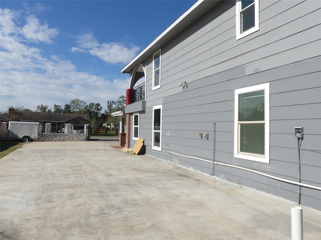 view of property exterior featuring a patio area