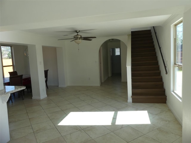 interior space featuring ceiling fan and light tile patterned floors