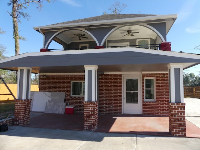 exterior space featuring ceiling fan