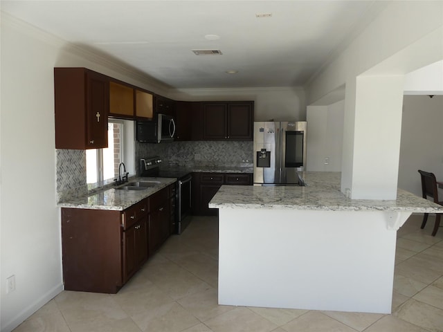 kitchen with appliances with stainless steel finishes, light stone counters, crown molding, and sink