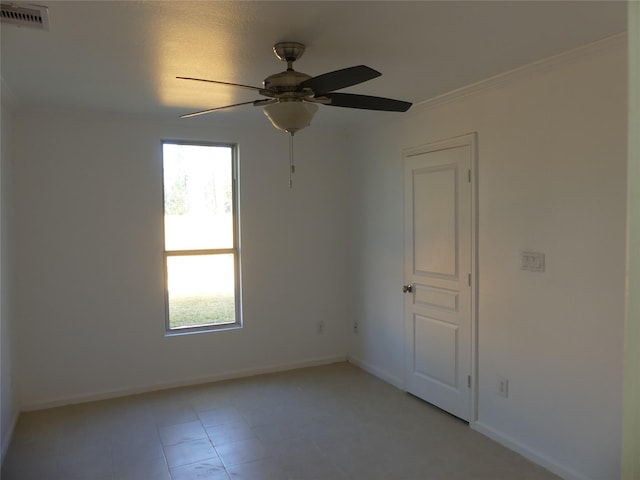 unfurnished room featuring ceiling fan and crown molding