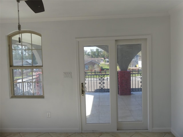 entryway featuring tile patterned flooring and crown molding