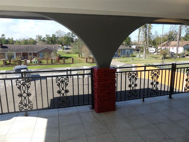 view of gate with a lawn