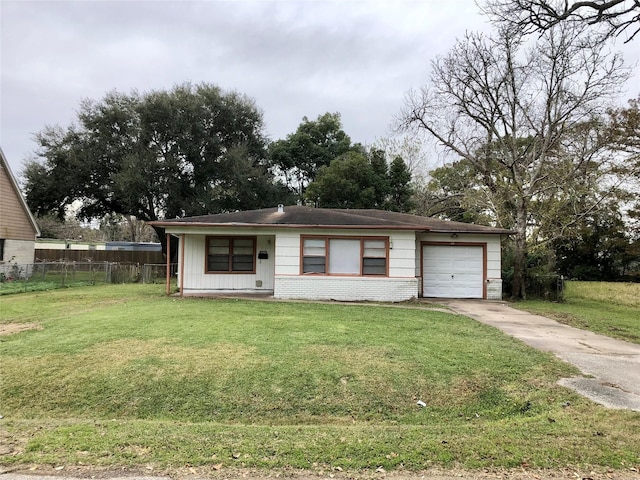 view of front of home with a front lawn and a garage