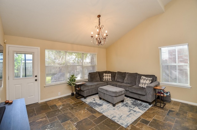 living room featuring a chandelier, lofted ceiling, and a healthy amount of sunlight