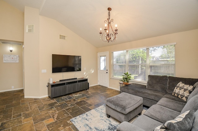 living room featuring high vaulted ceiling and an inviting chandelier