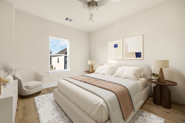 bedroom featuring ceiling fan and light hardwood / wood-style flooring