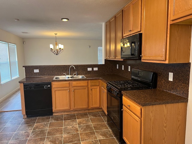 kitchen featuring decorative backsplash, kitchen peninsula, sink, black appliances, and a notable chandelier