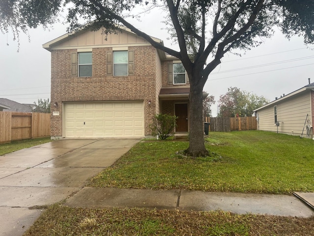 view of front facade featuring a garage and a front lawn