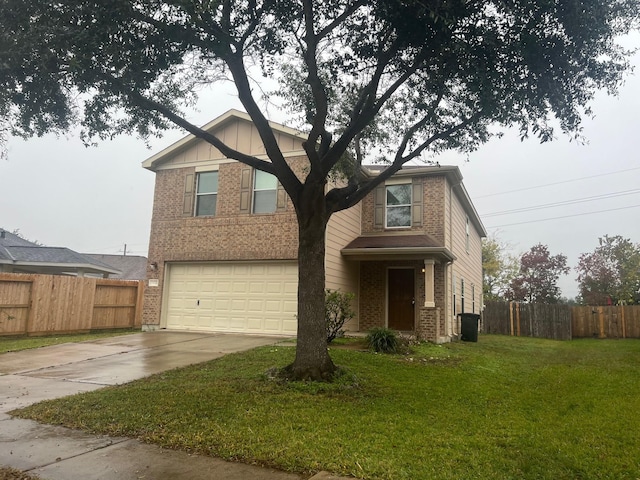 view of front of home with a garage and a front lawn