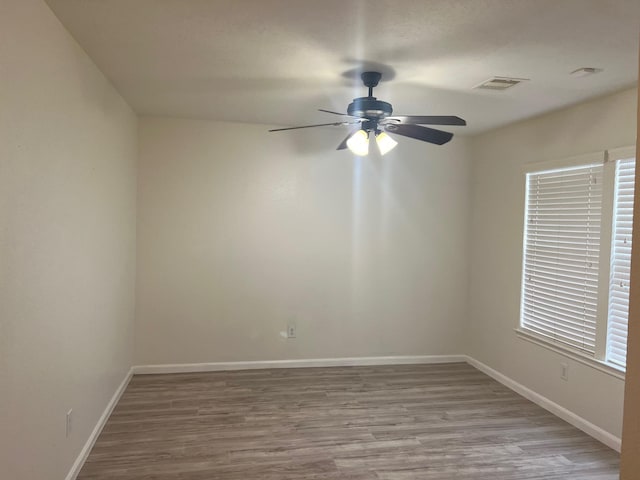 spare room with light hardwood / wood-style flooring and ceiling fan