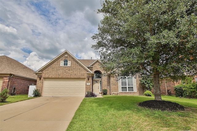 view of front of property featuring a front lawn and a garage