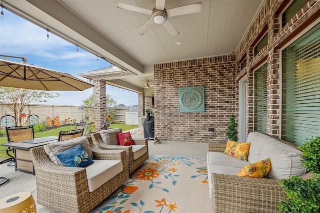 view of patio / terrace with an outdoor living space and ceiling fan