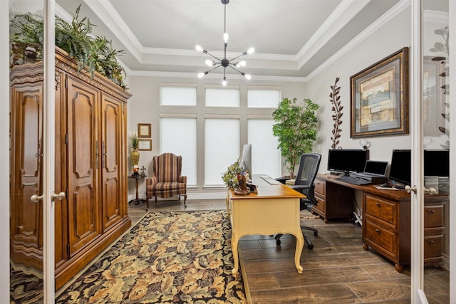 office area featuring a raised ceiling, ornamental molding, and an inviting chandelier