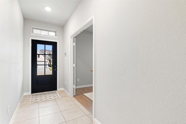 entrance foyer with light tile patterned floors