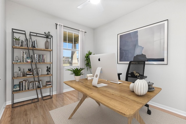 office with light wood-type flooring