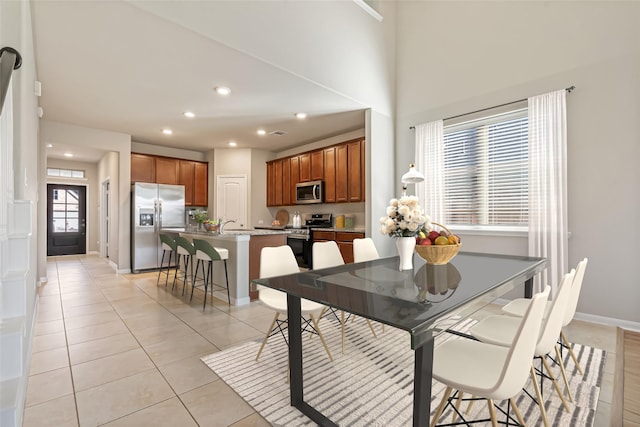 dining space with light tile patterned flooring