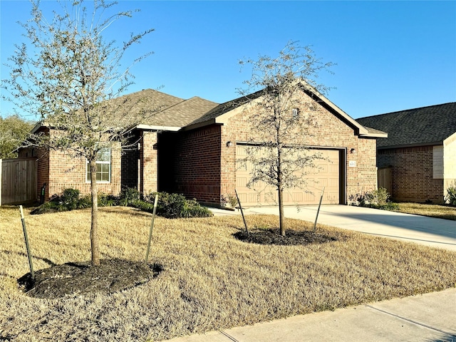 ranch-style house featuring a front yard and a garage