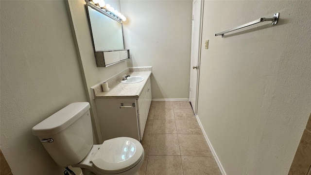 7204 Crownwest St Unit 7204, Houston, TX 77072 - half bathroom with tile patterned floors, baseboards, vanity, toilet, and a textured wall
