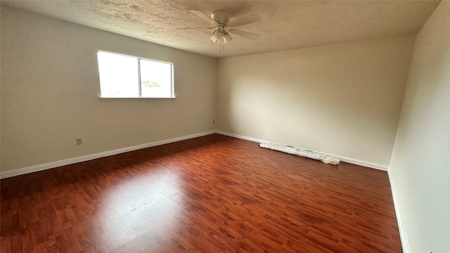 7204 Crownwest St Unit 7204, Houston, TX 77072 - unfurnished room featuring baseboards, a ceiling fan, and dark wood finished floors
