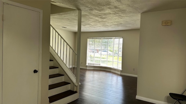 7204 Crownwest St Unit 7204, Houston, TX 77072 - stairs with baseboards, a textured ceiling, and wood finished floors