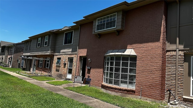 7204 Crownwest St Unit 7204, Houston, TX 77072 - view of property with a front yard and brick siding