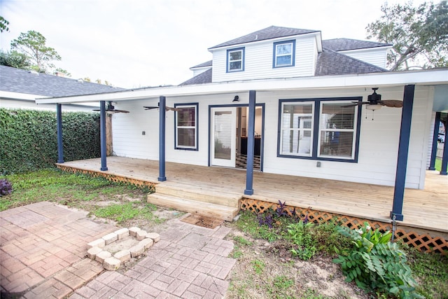 exterior space with ceiling fan