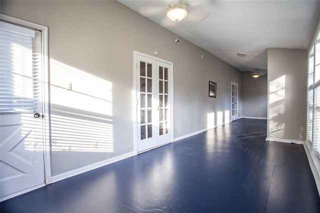 unfurnished room featuring ceiling fan and french doors