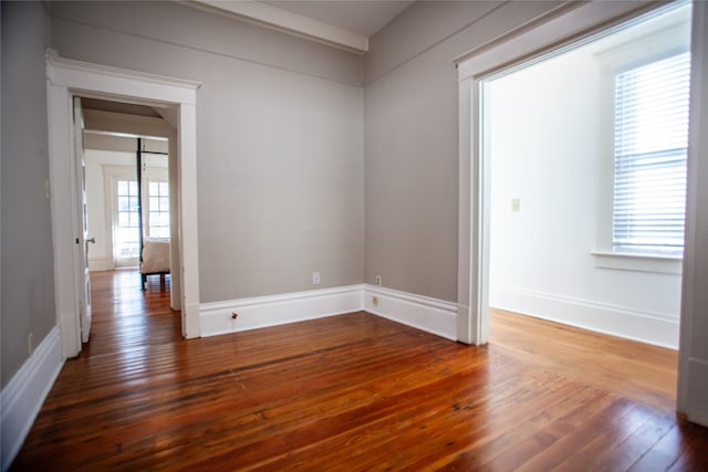 unfurnished room featuring hardwood / wood-style floors