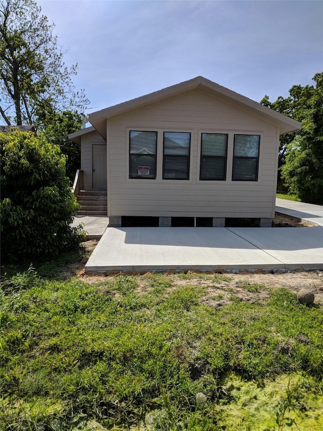 rear view of house with a patio