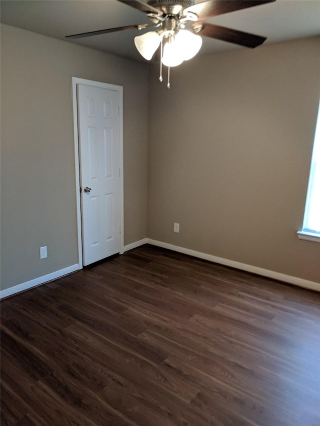 empty room with dark hardwood / wood-style floors