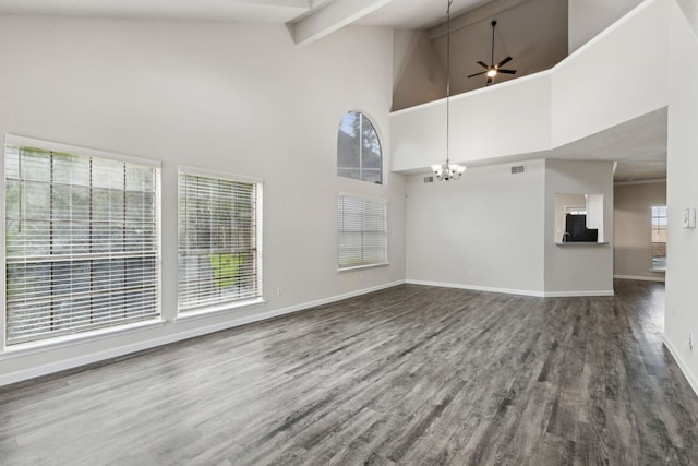 unfurnished living room featuring beamed ceiling, ceiling fan with notable chandelier, hardwood / wood-style flooring, and high vaulted ceiling