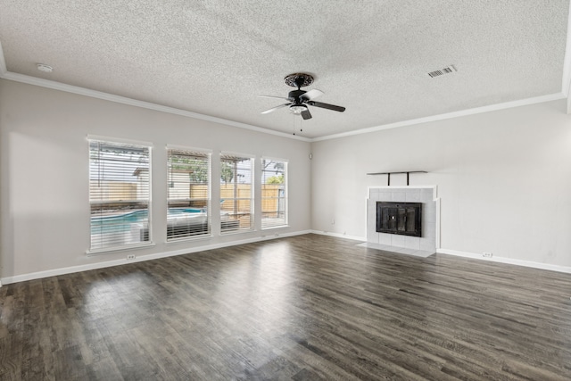 unfurnished living room with ceiling fan, a fireplace, and ornamental molding