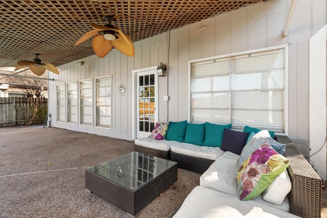 exterior space featuring ceiling fan, wood walls, and carpet floors