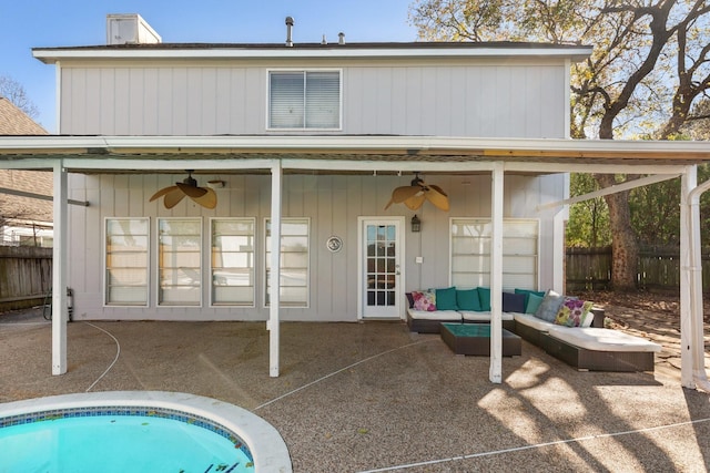 back of house with a fenced in pool, ceiling fan, a patio, and an outdoor hangout area