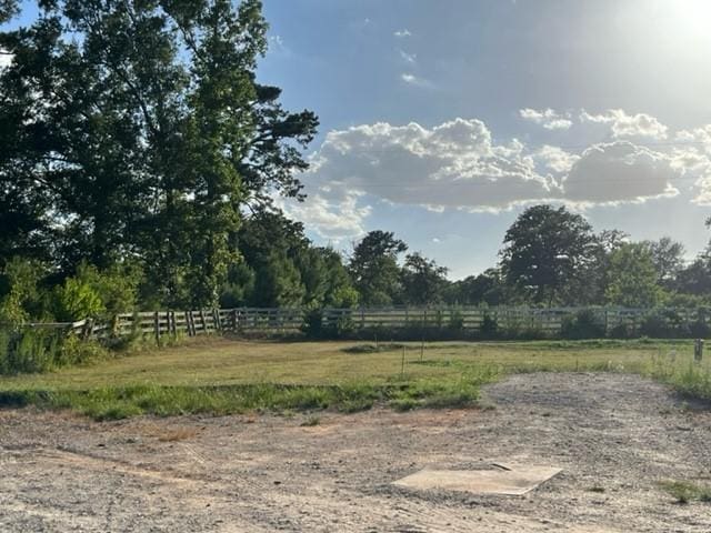 view of yard with a rural view