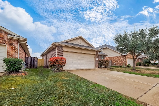 view of front of house with a front yard and a garage