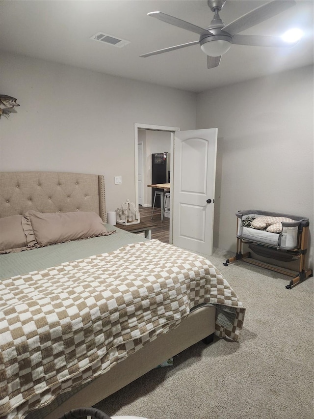 carpeted bedroom with ceiling fan