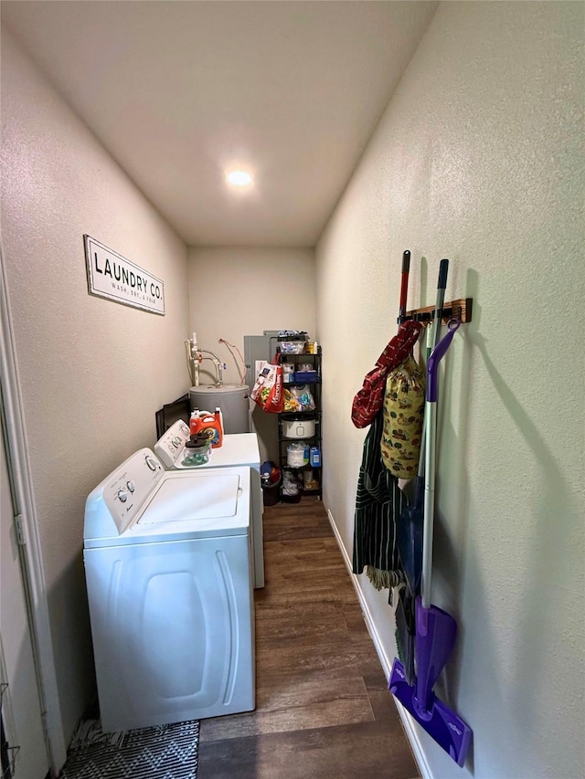 1000 Fm 224th Rd, Coldspring, TX 77331 - laundry area featuring washer and clothes dryer, dark wood-style flooring, a textured wall, and water heater