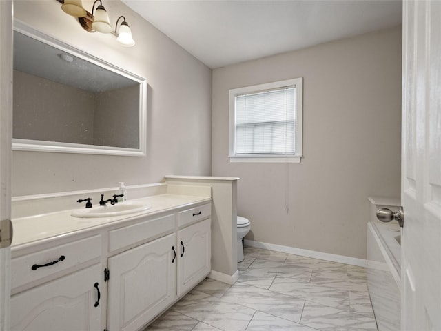 bathroom with vanity and toilet