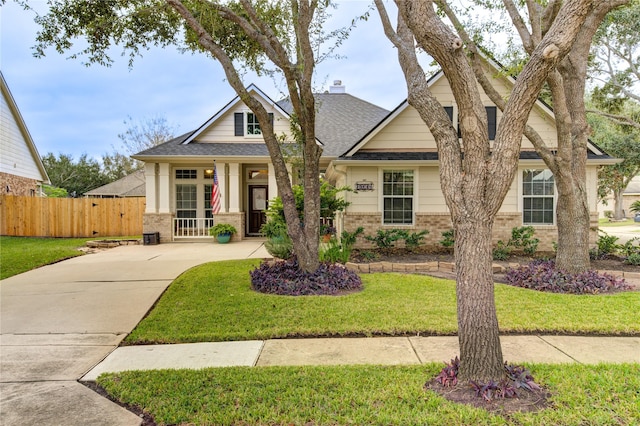 craftsman-style house with a front yard