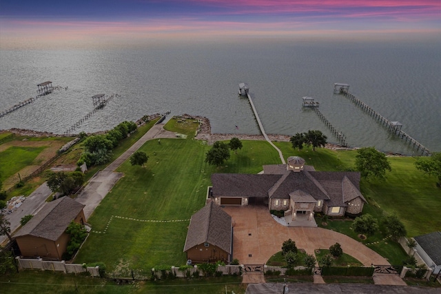 aerial view at dusk with a water view