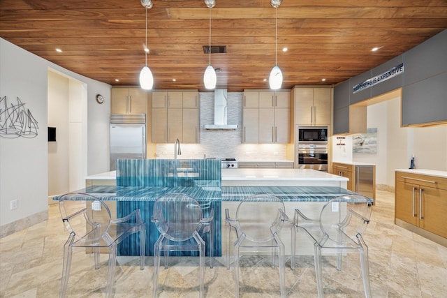 kitchen featuring wall chimney range hood, hanging light fixtures, built in appliances, decorative backsplash, and wood ceiling