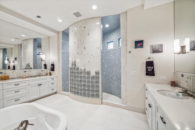 bathroom featuring tile patterned floors, vanity, tile walls, and shower with separate bathtub