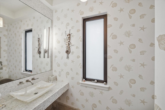 bathroom with sink and a healthy amount of sunlight