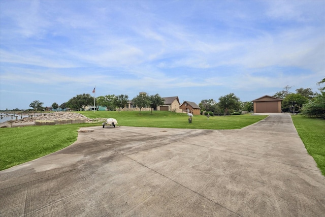 view of patio featuring a garage and an outdoor structure